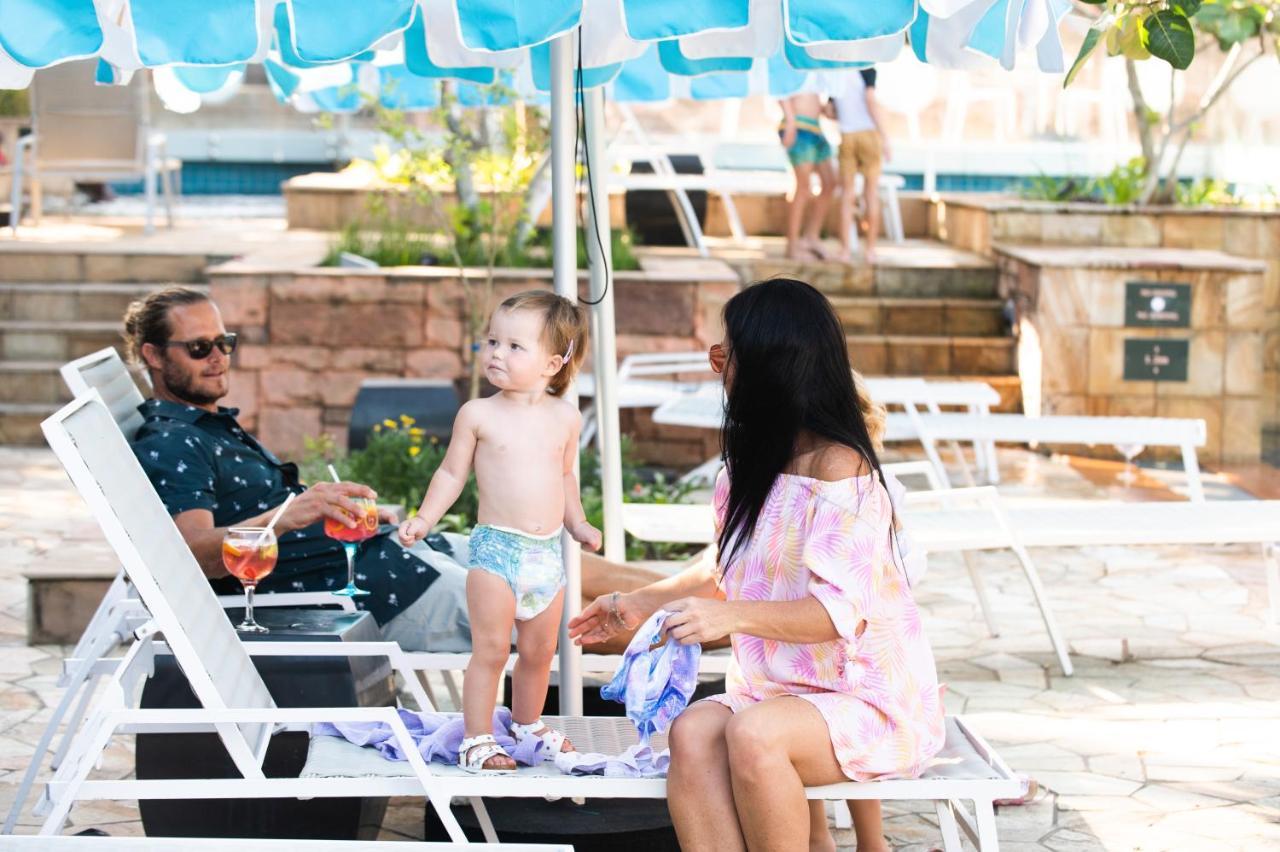 Hotel The Capital Zimbali Ballito Exterior foto Family at the pool